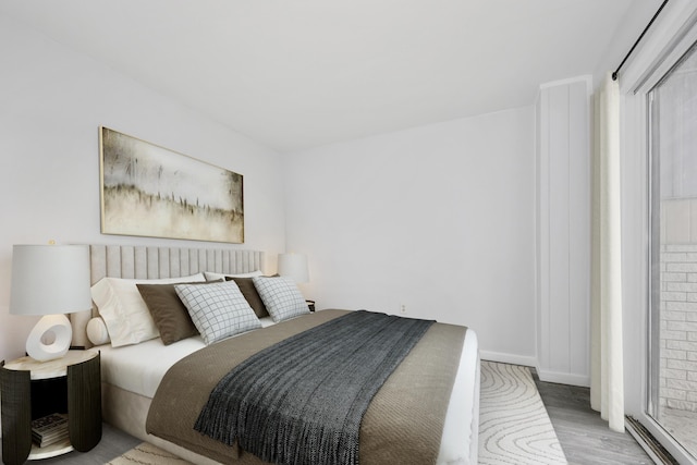 9 Winnisquam Shr, Tilton, NH 03276 - bedroom featuring wood finished floors, baseboards, and multiple windows