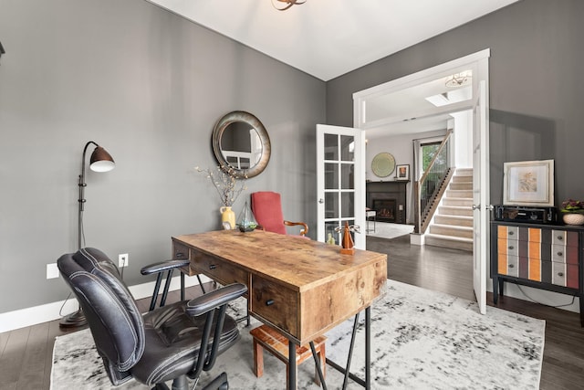 36 Caspian Ln, Shelburne, VT 05482 - office space featuring a fireplace, wood finished floors, and baseboards