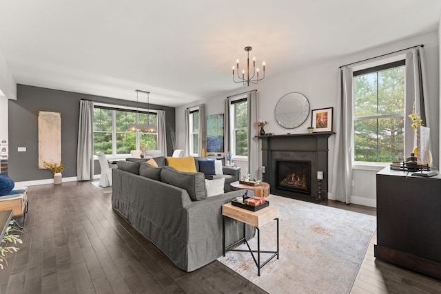 36 Caspian Ln, Shelburne, VT 05482 - living room with a chandelier, dark wood-style flooring, plenty of natural light, and baseboards