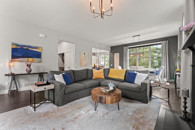 36 Caspian Ln, Shelburne, VT 05482 - living room with a chandelier, wood finished floors, and baseboards