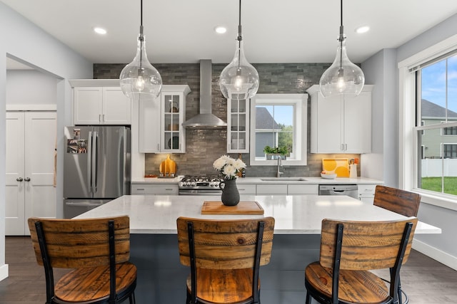36 Caspian Ln, Shelburne, VT 05482 - kitchen with stainless steel appliances, wall chimney exhaust hood, a sink, decorative backsplash, and recessed lighting