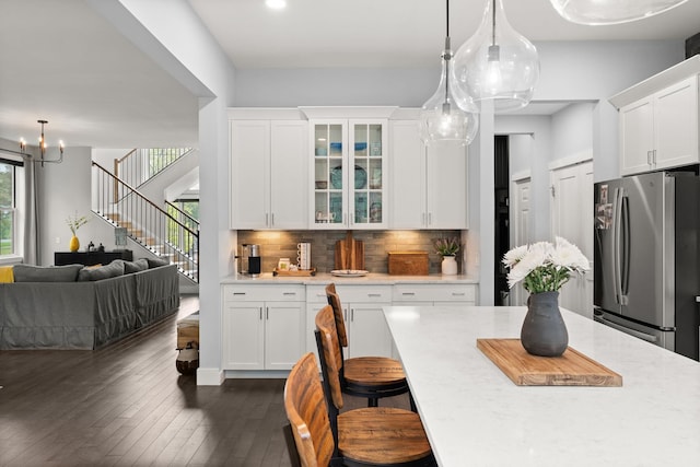 36 Caspian Ln, Shelburne, VT 05482 - kitchen featuring freestanding refrigerator, light countertops, glass insert cabinets, white cabinets, and recessed lighting
