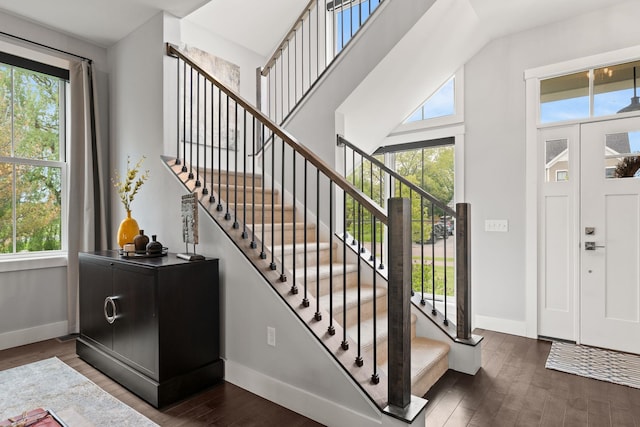 36 Caspian Ln, Shelburne, VT 05482 - entrance foyer with baseboards, dark wood finished floors, stairs, and a high ceiling