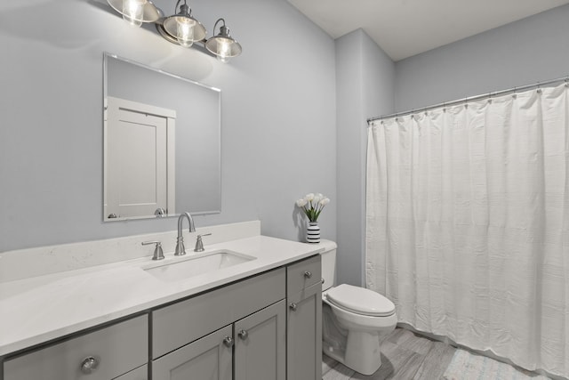 36 Caspian Ln, Shelburne, VT 05482 - bathroom with toilet, vanity, and a shower with curtain
