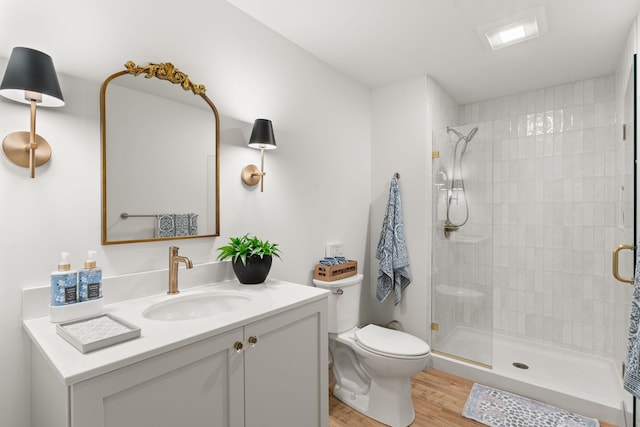 36 Caspian Ln, Shelburne, VT 05482 - full bath featuring toilet, vanity, wood finished floors, and a stall shower