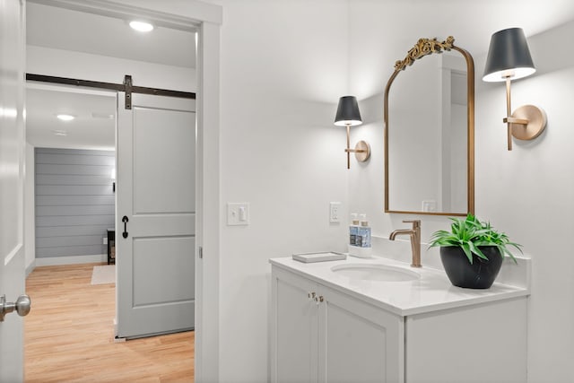 36 Caspian Ln, Shelburne, VT 05482 - bathroom featuring vanity, wood finished floors, baseboards, and recessed lighting