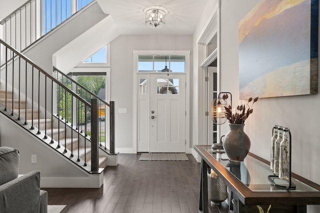 36 Caspian Ln, Shelburne, VT 05482 - foyer with dark wood-style flooring, a chandelier, stairway, baseboards, and a towering ceiling