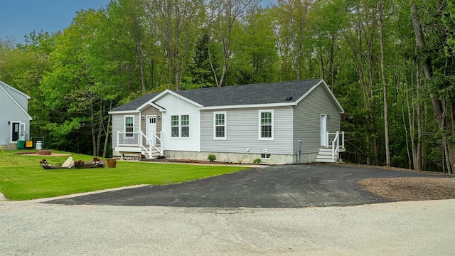 26 Deerfield Ct, Rochester, NH 03868 - manufactured / mobile home with roof with shingles and a front yard