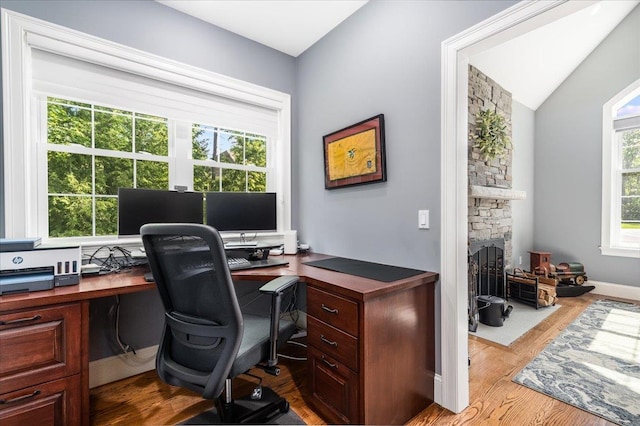 72 Settlers Ct, Bedford, NH 03110 - office space featuring wood finished floors, a stone fireplace, and vaulted ceiling