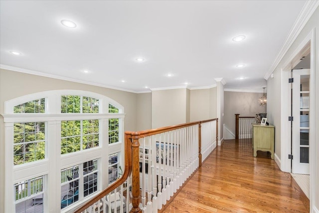 72 Settlers Ct, Bedford, NH 03110 - hallway featuring an upstairs landing, light wood-type flooring, recessed lighting, ornamental molding, and a chandelier