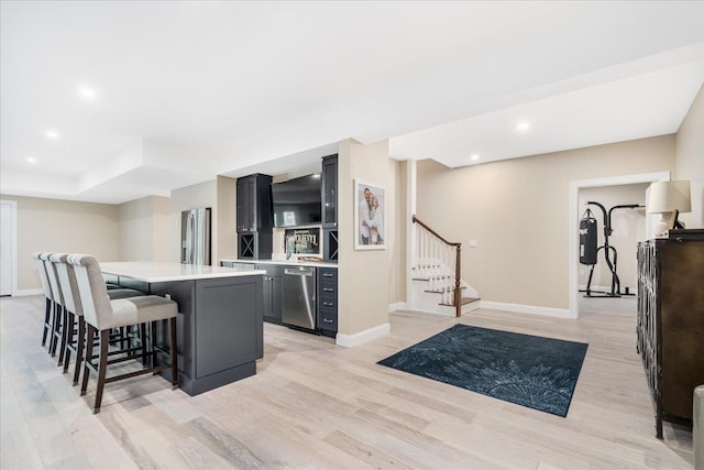 72 Settlers Ct, Bedford, NH 03110 - kitchen with a kitchen breakfast bar, stainless steel appliances, light countertops, baseboards, and recessed lighting