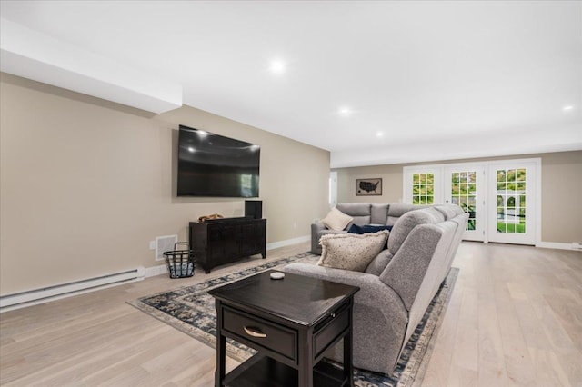 72 Settlers Ct, Bedford, NH 03110 - living area with baseboard heating, light wood-type flooring, baseboards, recessed lighting, and french doors