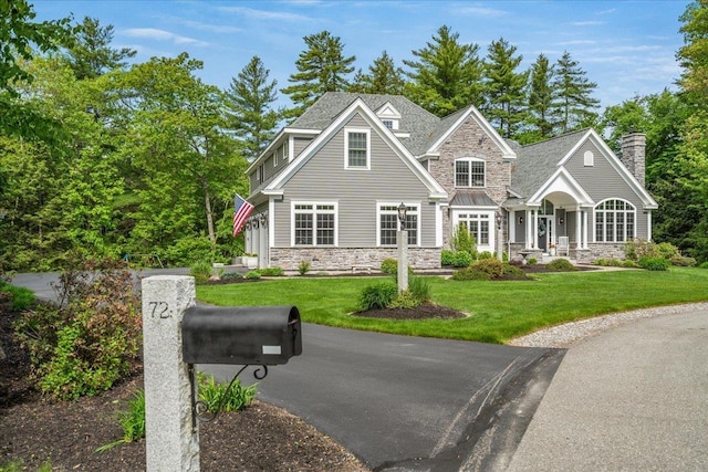 72 Settlers Ct, Bedford, NH 03110 - view of front of property featuring stone siding and a front yard