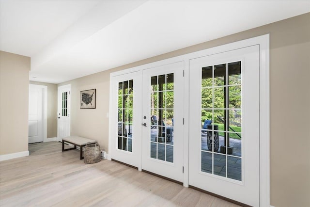 72 Settlers Ct, Bedford, NH 03110 - doorway with french doors, light wood-type flooring, and baseboards
