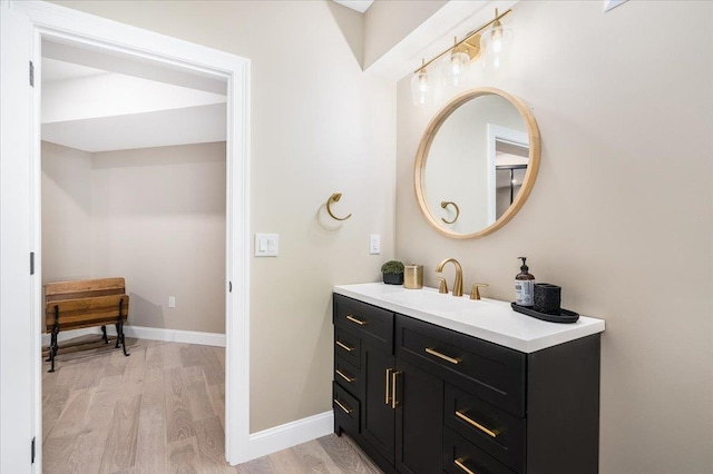 72 Settlers Ct, Bedford, NH 03110 - bathroom with wood finished floors, vanity, and baseboards