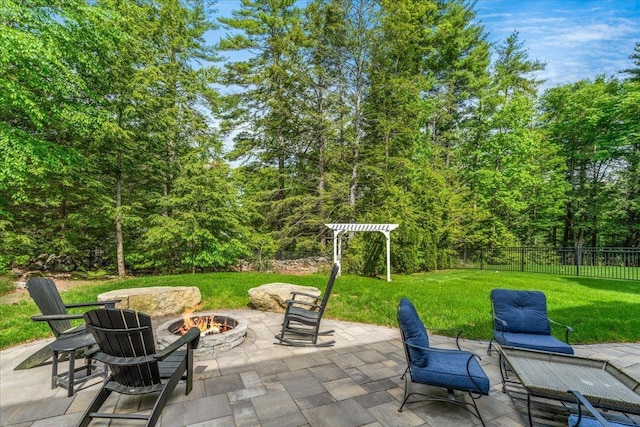 72 Settlers Ct, Bedford, NH 03110 - view of patio with a fire pit and a wooded view