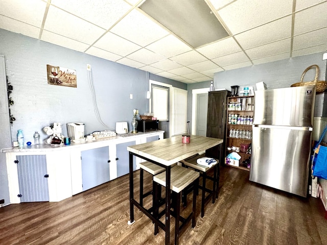 15 Park St, Colebrook, NH 03576 - dining area with a drop ceiling and wood finished floors