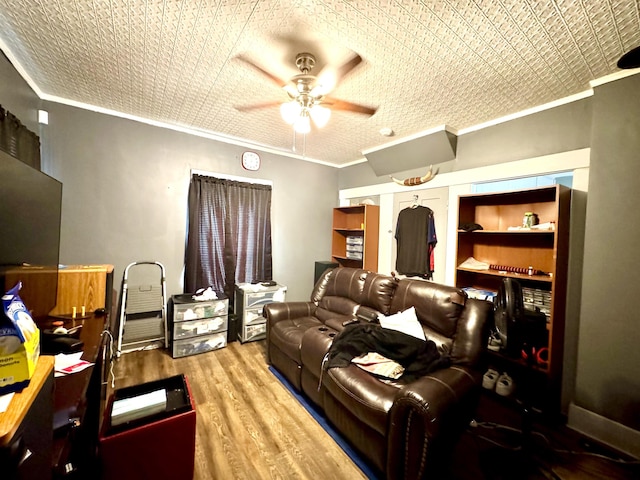 15 Park St, Colebrook, NH 03576 - home theater with crown molding, ceiling fan, and wood finished floors