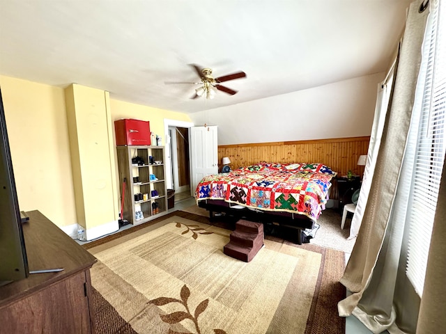 15 Park St, Colebrook, NH 03576 - bedroom featuring wainscoting, wood walls, and a ceiling fan