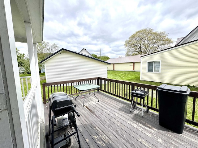 15 Park St, Colebrook, NH 03576 - wooden deck with a lawn and a grill