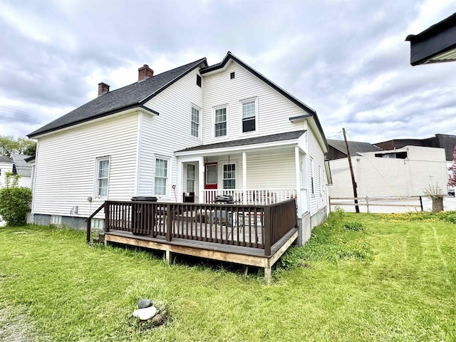 15 Park St, Colebrook, NH 03576 - rear view of property with a lawn, a chimney, and a shingled roof