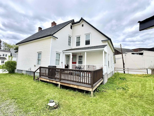 15 Park St, Colebrook, NH 03576 - back of house featuring a chimney and a wooden deck