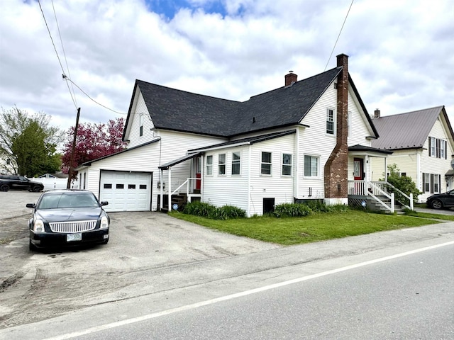 15 Park St, Colebrook, NH 03576 - view of side of home with a chimney, a garage, driveway, and roof with shingles