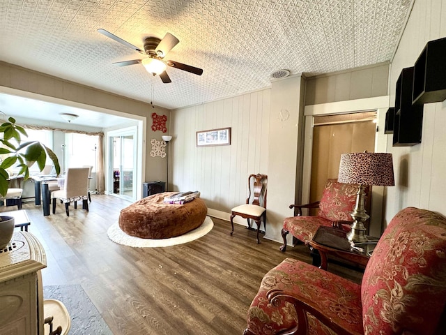 15 Park St, Colebrook, NH 03576 - sitting room with a ceiling fan, wood finished floors, and wood walls