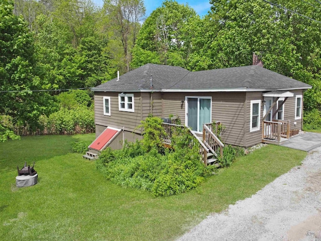 20 Daniel Webster Hwy, Plymouth, NH 03264 - view of front facade featuring a front lawn, a deck, roof with shingles, and a chimney