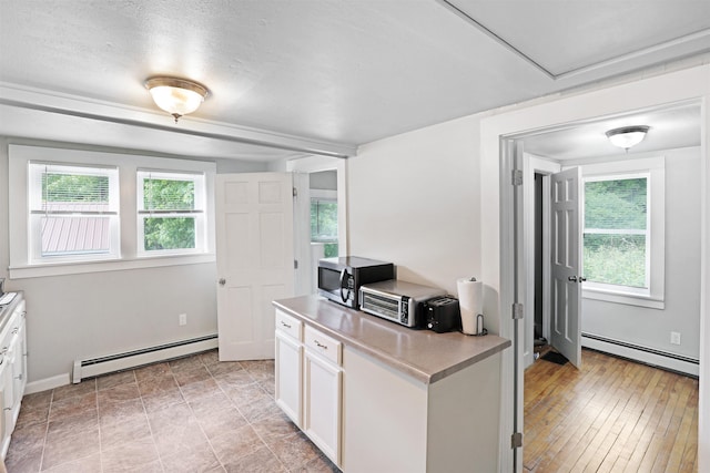 20 Daniel Webster Hwy, Plymouth, NH 03264 - home office featuring a baseboard radiator, healthy amount of natural light, and baseboards