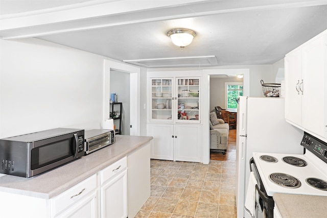 20 Daniel Webster Hwy, Plymouth, NH 03264 - kitchen with electric range oven, stainless steel microwave, white cabinets, light countertops, and stone finish flooring