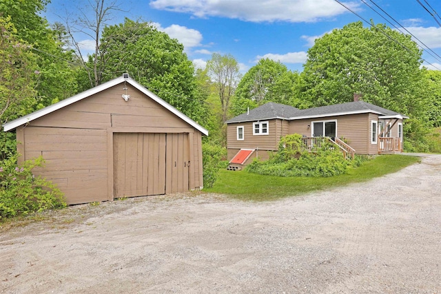 20 Daniel Webster Hwy, Plymouth, NH 03264 - ranch-style house featuring a detached garage, a chimney, an outbuilding, and dirt driveway