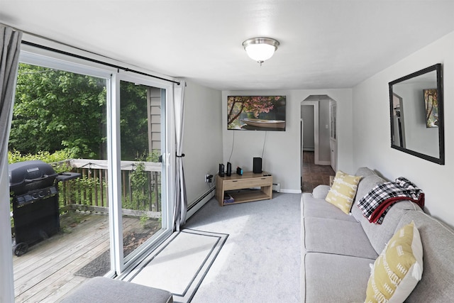 20 Daniel Webster Hwy, Plymouth, NH 03264 - living room with a baseboard heating unit, baseboards, and arched walkways