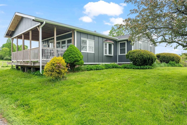 870 Cheesefactory Rd, Shelburne, VT 05482 - view of home's exterior featuring board and batten siding and a lawn