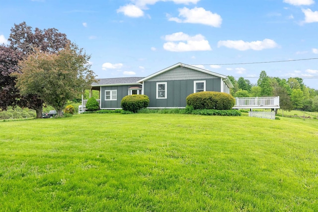 870 Cheesefactory Rd, Shelburne, VT 05482 - view of front of property with board and batten siding, a front lawn, and a deck