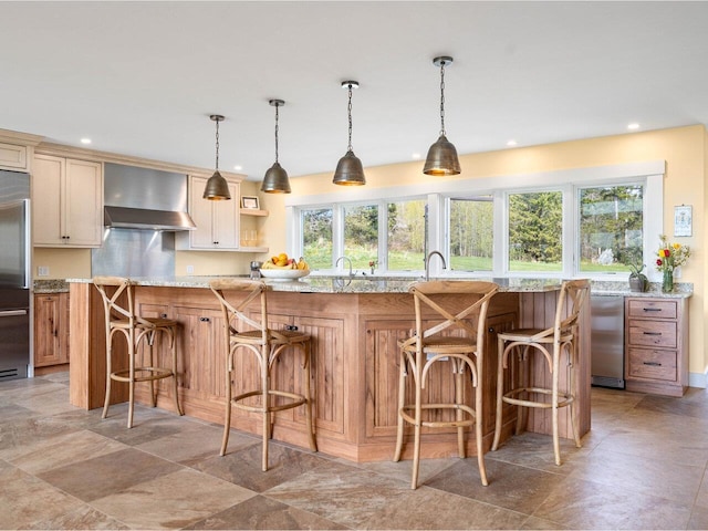 344 Morrie Rd, Washington, VT 05675 - kitchen featuring fridge, wall chimney range hood, plenty of natural light, recessed lighting, and a breakfast bar