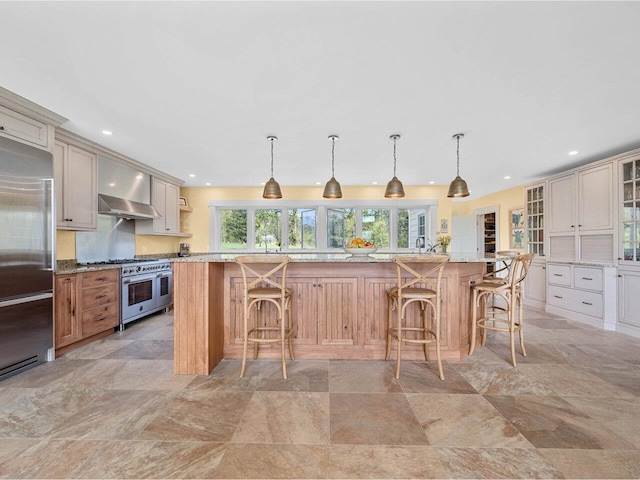 344 Morrie Rd, Washington, VT 05675 - kitchen featuring high quality appliances, wall chimney exhaust hood, a kitchen breakfast bar, glass insert cabinets, and recessed lighting