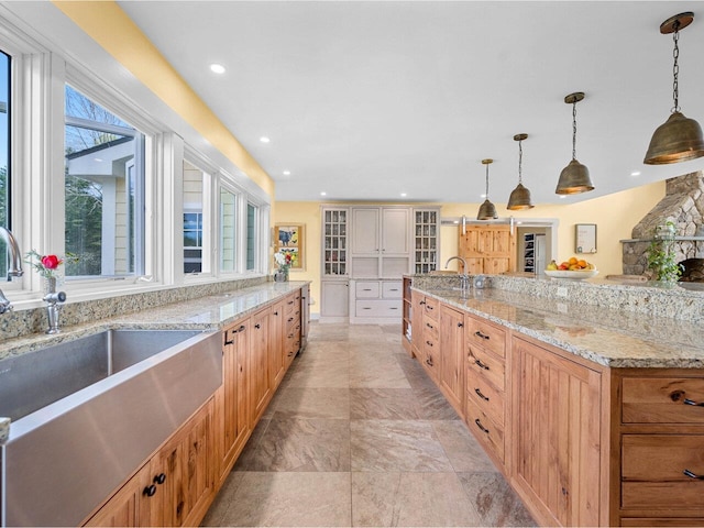 344 Morrie Rd, Washington, VT 05675 - kitchen with a sink, pendant lighting, glass insert cabinets, recessed lighting, and light stone countertops