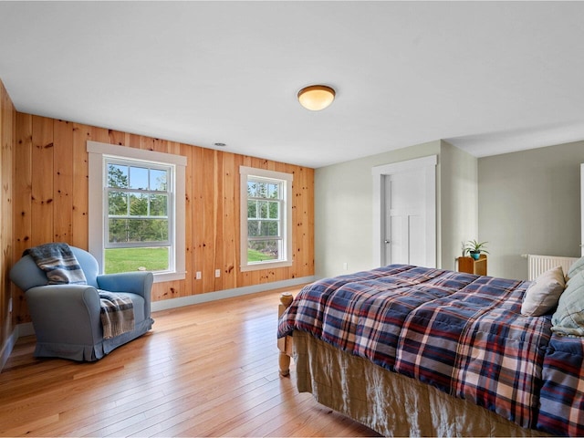 344 Morrie Rd, Washington, VT 05675 - bedroom with light wood-style floors, baseboards, and wooden walls