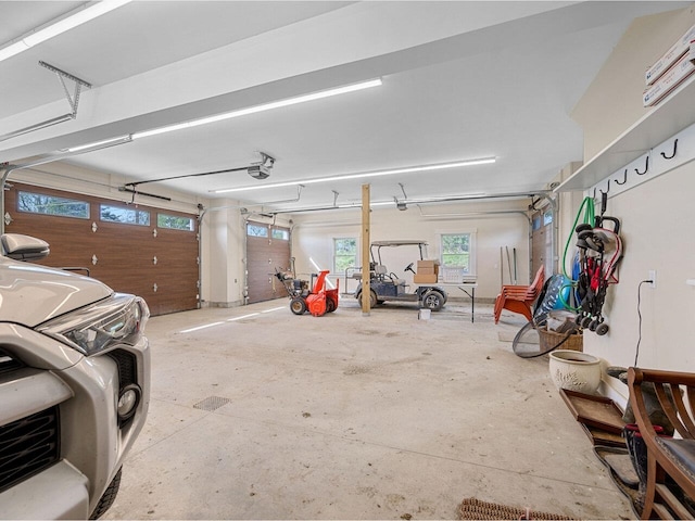344 Morrie Rd, Washington, VT 05675 - garage featuring a garage door opener