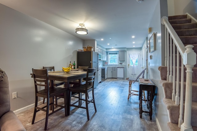 78 Saco Pines Rd Unit 9, Conway, NH 03813 - dining room featuring stairway, wood finished floors, baseboards, and recessed lighting