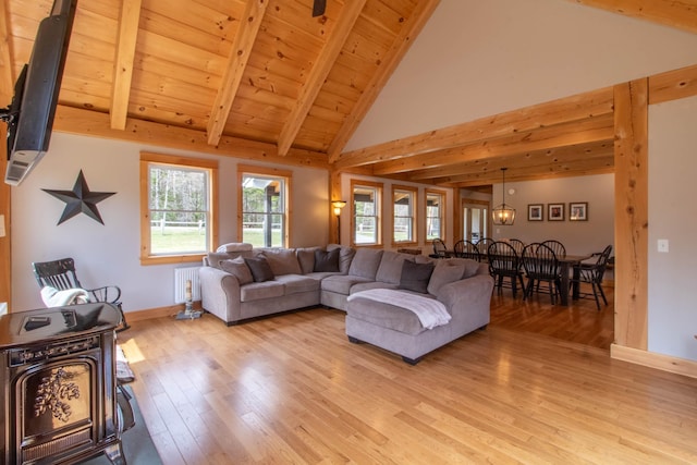 51 Lake View Rd, Westmore, VT 05822 - living area featuring light wood-style floors, radiator heating unit, baseboards, high vaulted ceiling, and wood ceiling with exposed beams