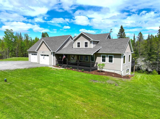 51 Lake View Rd, Westmore, VT 05822 - view of front of home with a porch, asphalt driveway, a shingled roof, a front lawn, and a garage
