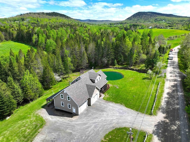 51 Lake View Rd, Westmore, VT 05822 - view from above of property with a heavily wooded area and a mountainous background