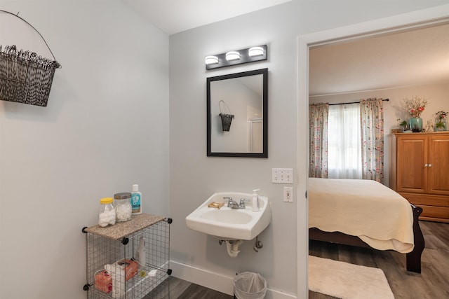 71 Scottsdale Rd, Newport City, VT 05855 - bathroom featuring wood finished floors, a sink, and baseboards