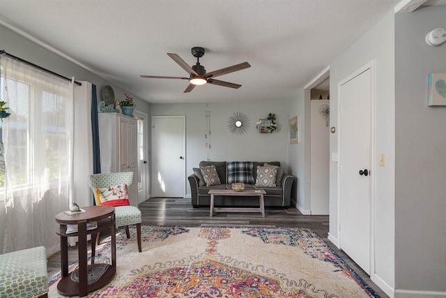 71 Scottsdale Rd, Newport City, VT 05855 - living room featuring a ceiling fan, wood finished floors, and baseboards