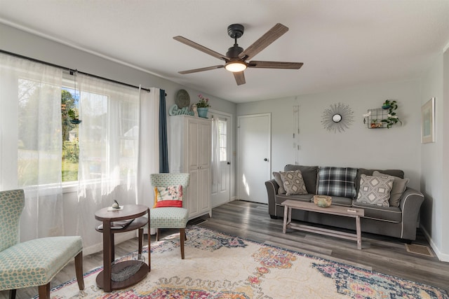 71 Scottsdale Rd, Newport City, VT 05855 - living room with wood finished floors, a ceiling fan, and baseboards