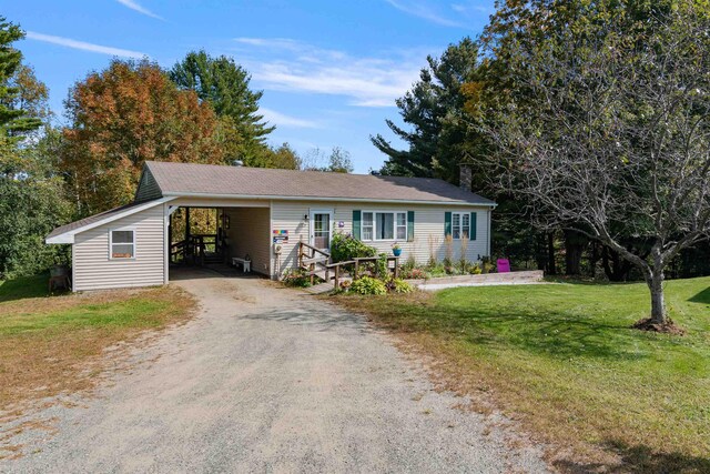 71 Scottsdale Rd, Newport City, VT 05855 - single story home with driveway, a front yard, and an attached carport