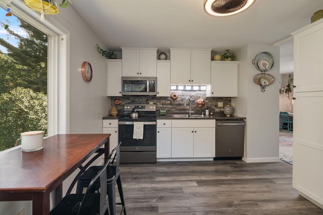 71 Scottsdale Rd, Newport City, VT 05855 - kitchen with appliances with stainless steel finishes, a sink, dark countertops, and plenty of natural light