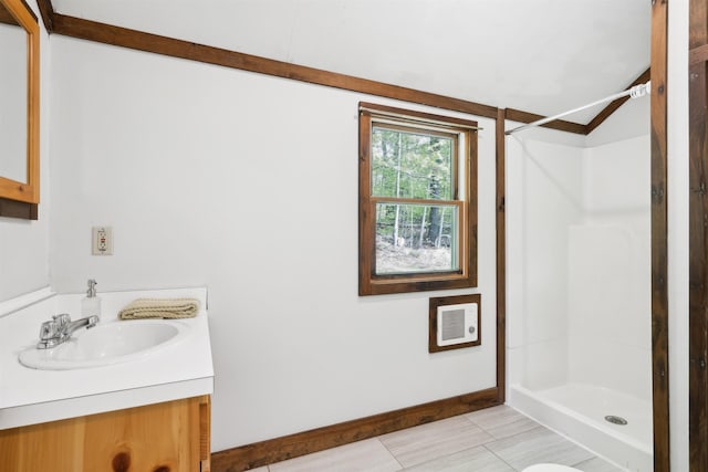 1176 Cross Rd, Strafford, VT 05070 - bathroom with a shower stall, vanity, baseboards, and heating unit